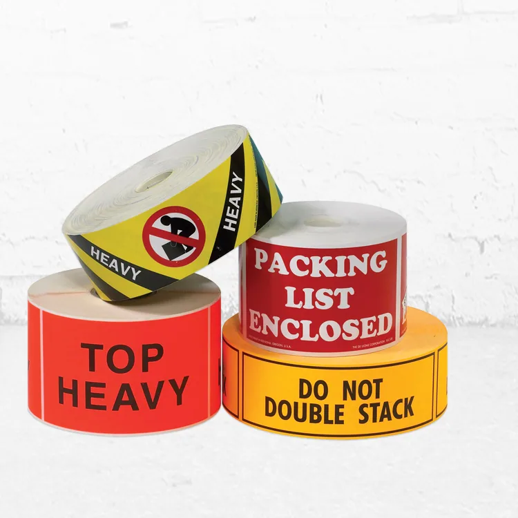 Rolls of Top Heavy, Packing List Enclosed, Heavy and Do Not Double Stack labels