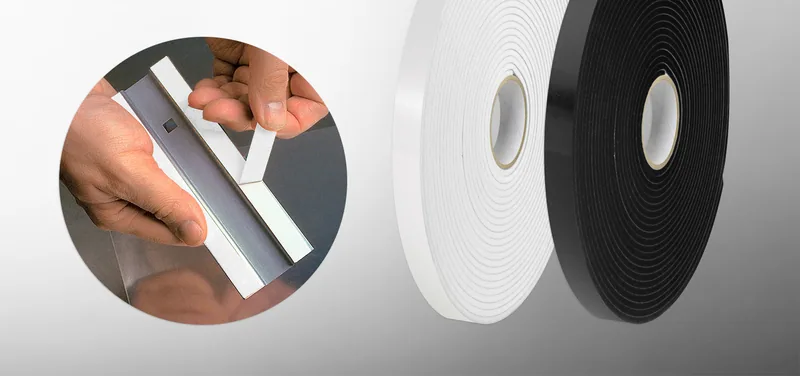 White and black double-sided foam tape rolls, with a hand pressing foam tape