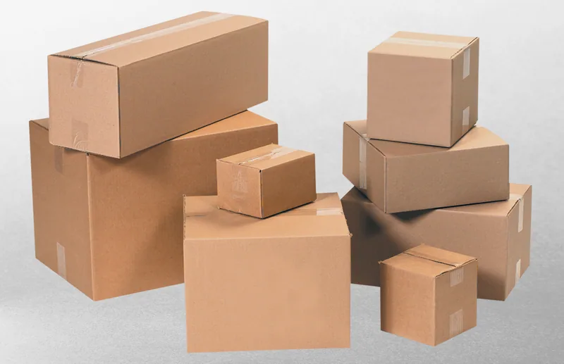 Stacked Tape Logic corrugated shipping boxes in several sizes